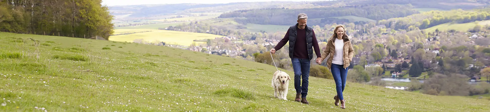 Couple walking thir dog