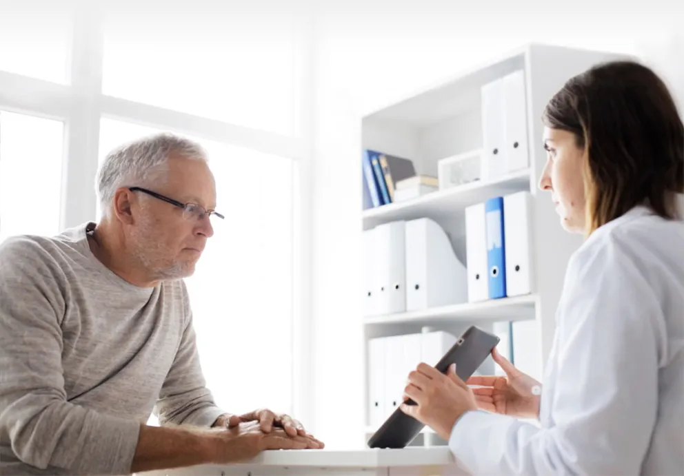 Hero imageHealth professional with patient explaining results
